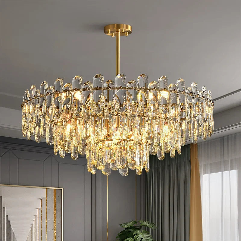 Luxurious chandelier hanging in a room with gray walls and a window.